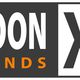 Logo met tekst "WOON TRENDS XL" in zwart-wit en oranje.