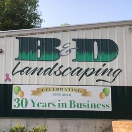 B&D Landscaping celebrates 30 years in business with a banner and balloons.