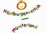 Buntes Logo mit Schriftzug "Hüpfburgenverleih Münsterland" und gezeichnetem Gesicht oben.