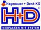 Logo von Hagenauer + Denk KG, H+D in Blau und Rot, Slogan „VERPACKEN MIT SYSTEM“.
