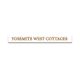 Sign reading "Yosemite West Cottages" in brown text on a white background.