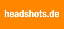 Weiße Schrift "headshots.de" auf orangem Hintergrund.