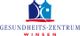 Logo des Gesundheitszentrums Winsen, mit stilisierten Gebäuden, in Blau und Rot.