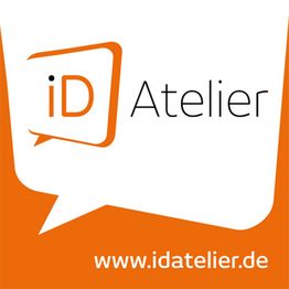 Orange-weißes Logo mit "iD Atelier" und Website www.idatelier.de.