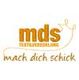 Logo mit Schriftzug "mds Textilveredelung" und Slogan "mach dich schick" in Orange.