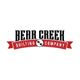 "Bear Creek Quilting Company logo with a red ribbon and bear paw design."