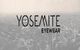 Yosemite Eyewear logo over a grayscale aerial cityscape background.
