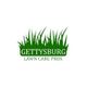 Logo of Gettysburg Lawn Care Pros with green grass design on a white background.