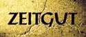 Gelber Hintergrund mit dem schwarzen Schriftzug "ZEITGUT".