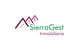 Logotipo de SierraGest Inmobiliaria con ilustraciones de montañas y casas en tonos morado y verde.