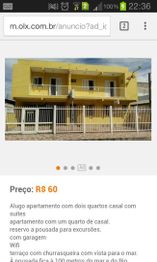 Prédio amarelo de dois andares com sacadas e portão, anúncio de aluguel de R$ 60.