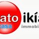 Logo di un'agenzia immobiliare con scritta "Katoikía casa immobiliare" su sfondo bianco.