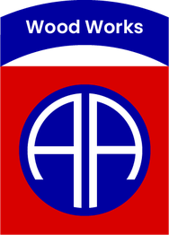 "Wood Works logo with blue and red colors, featuring stylized, white AA letters in a circle."
