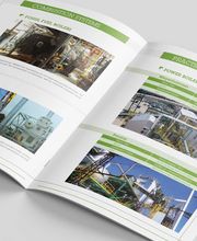 Revista abierta mostrando páginas con fotos e información técnica sobre calderas.