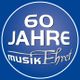 Blauer Kreis mit weißem Text: "60 Jahre Musik Ehret".