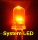 LED rosso acceso su sfondo scuro con testo giallo "System LED".