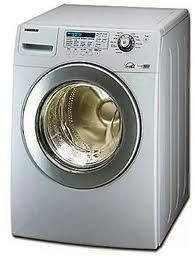 Front-loading washing machine with digital controls and metallic finish.
