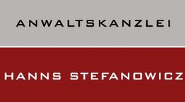 Graues und rotes Schild mit der Aufschrift "Anwaltskanzlei Hanns Stefanowicz" in Schwarz.