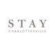"Stay Charlottesville logo with simple, elegant gray text on a white background."