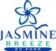 Logo of Jasmine Breeze RV Park, featuring a stylized floral design above the text.