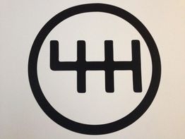 Símbolo de palanca de cambios manual con una circunferencia negra sobre fondo blanco.