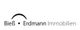 Logo mit Text: "Bieß Erdmann Immobilien", stilisiertes Dach darüber, schlichtes Design.