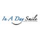 Logo of "In A Day Smile" Dental Implant Centers with a smile beneath the text.