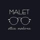 Logo con la scritta "MALET" e disegno di occhiali, testo "ottica moderna" su sfondo nero.