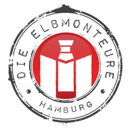 Logo mit rotem Schiff-Turm, Text: "Die Elbmonteure Hamburg" auf einem weißen Kreis.