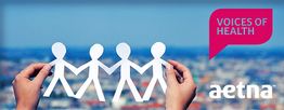 Mãos seguram recorte de papel de pessoas; texto: "Voices of Health" e "Aetna" ao fundo.