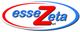 Logo di "esseZeta srl" con scritta blu e rossa in un ovale bianco bordato di rosso e blu.