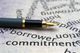 Fountain pen on paper with words like "borrower" and "commitment."