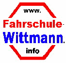 Rotes Achteck mit Schriftzug: "Fahrschule Wittmann" in Rot und Blau, Webseite oben und unten.