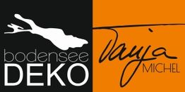 Schwarzes und oranges Logo mit Schriftzug "Bodensee Deko" und "Vanja Michel".