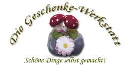 Zwei Filzfliegenpilze auf Moos, mit Text: "Die Geschenke-Werkstatt. Schöne Dinge selbst gemacht".