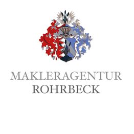 Wappen mit rotem und blauem Muster über "Makleragentur Rohrbeck" in stilvollem Schriftzug.