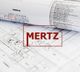 Blaupausen mit technischem Design, rotes Logo „MERTZ“ im Vordergrund.