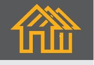 Ein stilisiertes gelbes Haus-Symbol auf grauem Hintergrund.