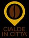 Logo con fagiolo di caffè marrone e testo "Cialde in Città" su sfondo nero.