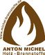 Logo von Anton Michel Holz-Brennstoffe mit Flammenmotiv und Website-URL in Braun und Weiß.