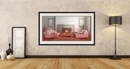 Modern room with wooden floor, framed artwork above fireplace, and tall floor lamp.