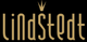 Schwarzes Logo mit beigem Text "Lindstedt" und kleiner Krone über dem "i".
