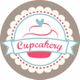 Logo mit "Cupcakery"-Schriftzug, einem Cupcake und Herz auf pastellfarbenem Hintergrund.