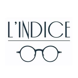 Texte "L'indice" avec dessin de lunettes rondes en dessous.
