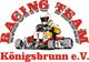 Ein Go-Kart-Fahrer im gelben Anzug und Helm mit "Racing Team Königsbrunn e.V." Text.