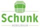 Logo mit grünem Würfel und Schriftzug "Schunk Mobilraum" in Grün und Grau.