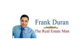 Man in a shirt and tie with "Frank Duran, The Real Estate Man" text beside him.