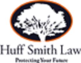 Logo of Huff Smith Law, featuring a tree silhouette inside an orange oval.