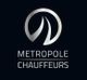 Logo von Metropole Chauffeurs mit stilisiertem M-Symbol auf schwarzem Hintergrund.