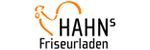 Logo von HAHN's Friseurladen mit stilisierter Schere in Orange.